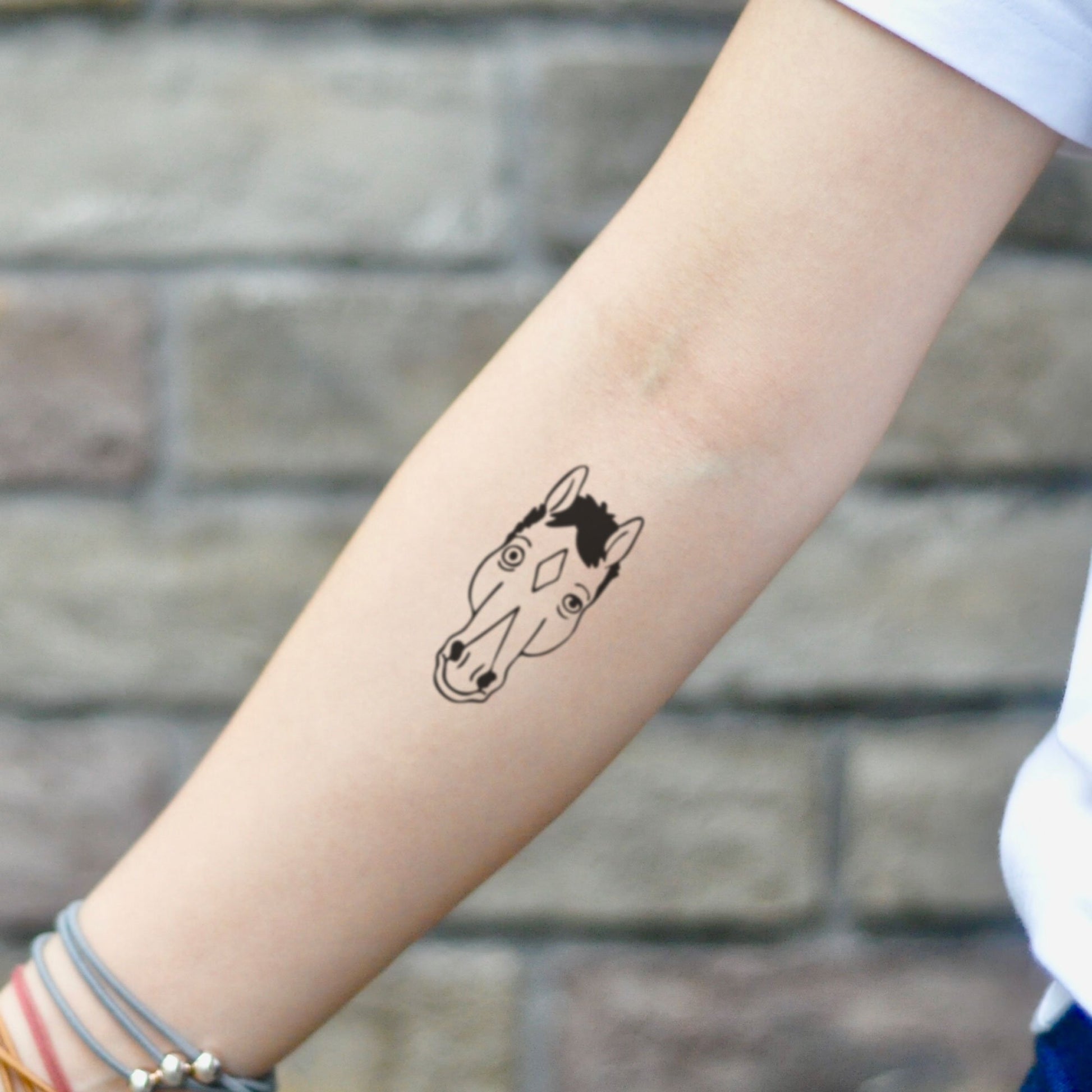 fake small bojack horseman cartoon temporary tattoo sticker design idea on inner arm