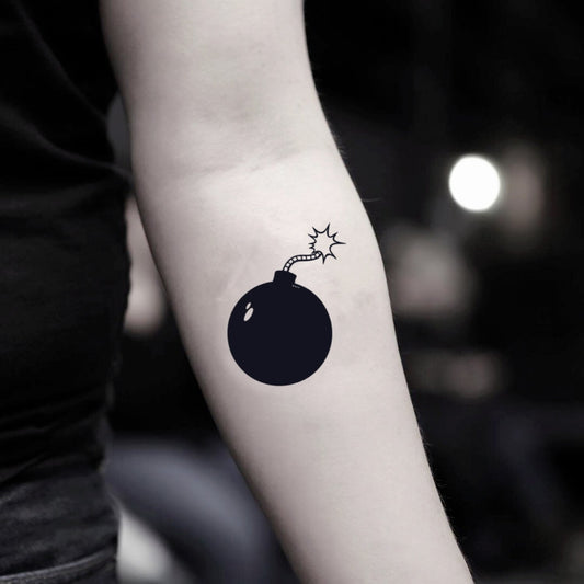 fake small time bomb minimalist temporary tattoo sticker design idea on inner arm