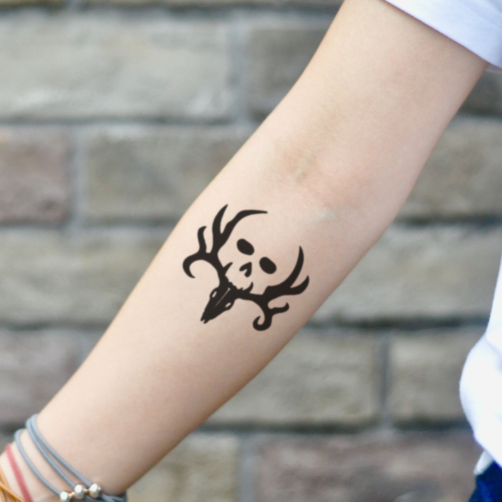 fake small bone collector minimalist temporary tattoo sticker design idea on inner arm