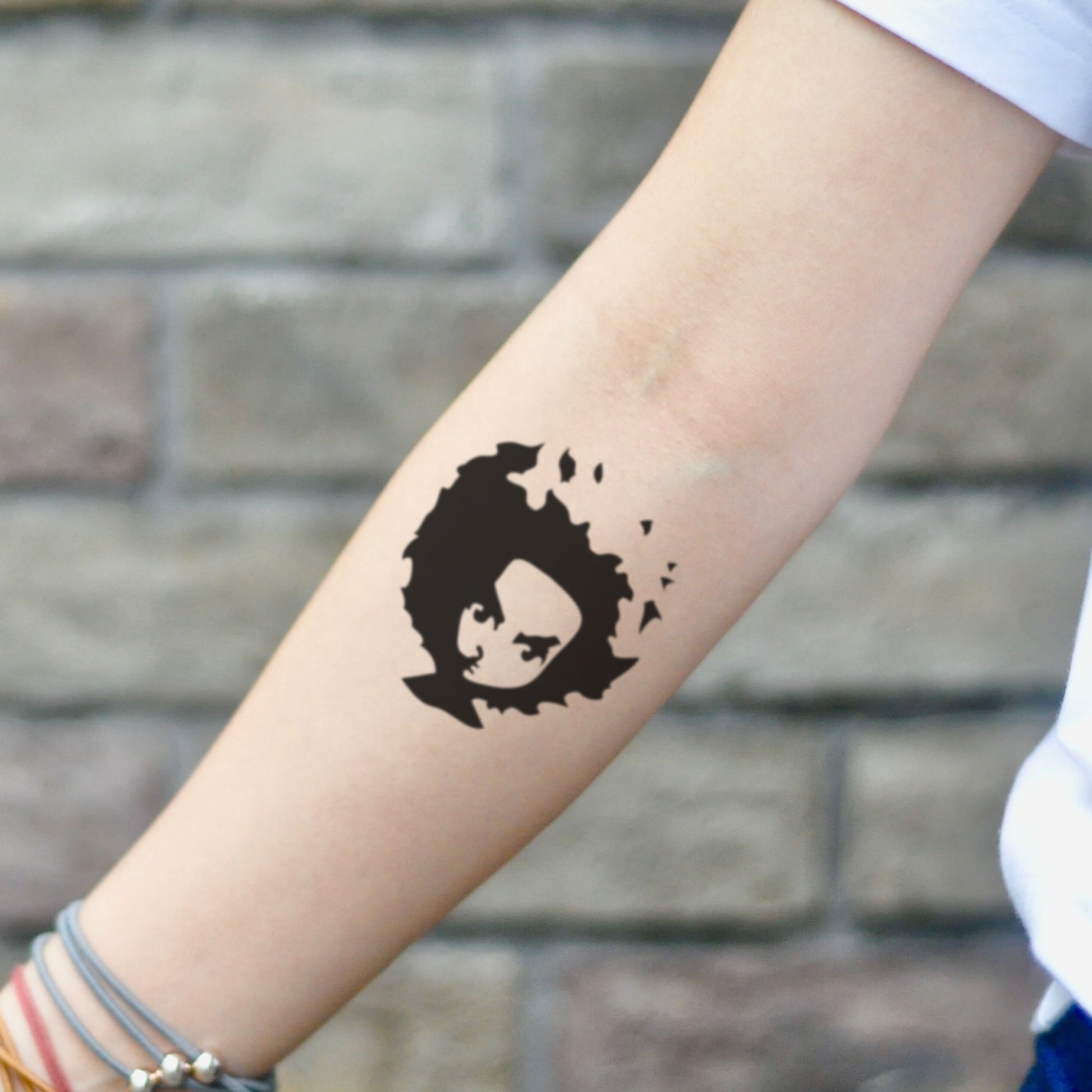 fake small boondocks cartoon temporary tattoo sticker design idea on inner arm