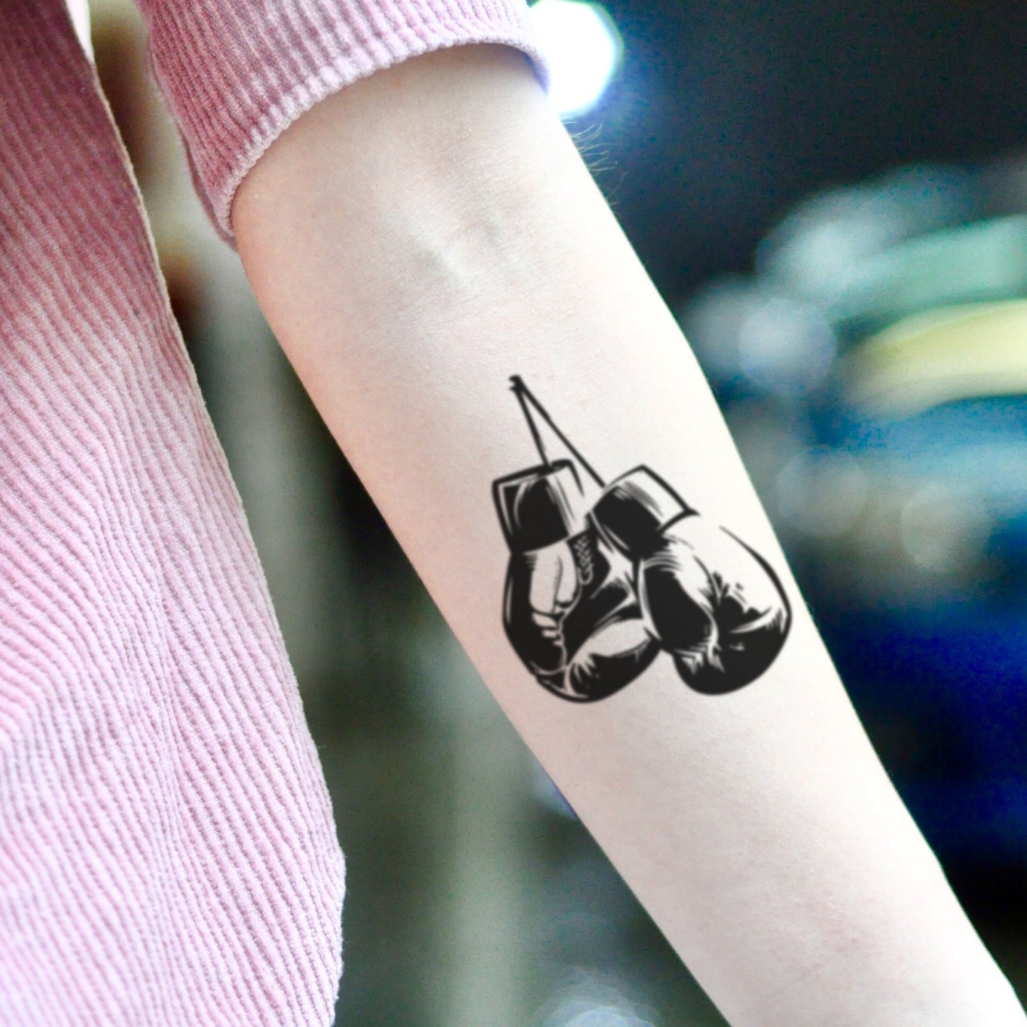 fake small boxing gloves illustrative temporary tattoo sticker design idea on inner arm