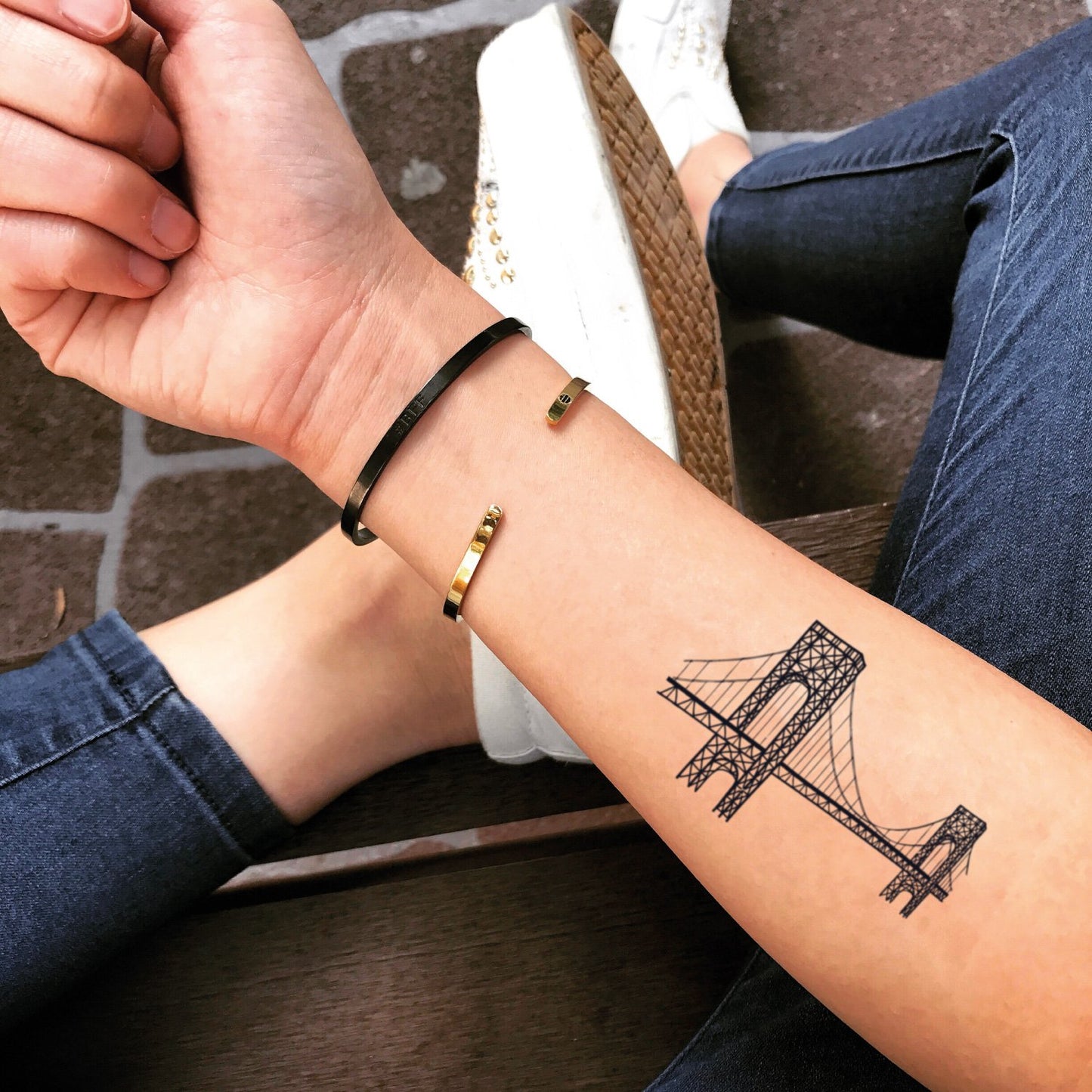 fake small golden gate bay bridge illustrative temporary tattoo sticker design idea on forearm