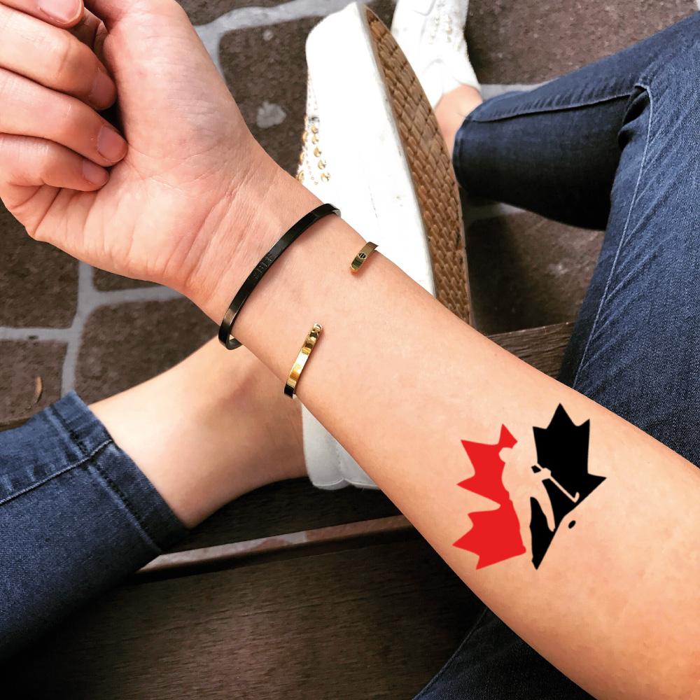 fake small canada hockey red leaf color temporary tattoo sticker design idea on forearm