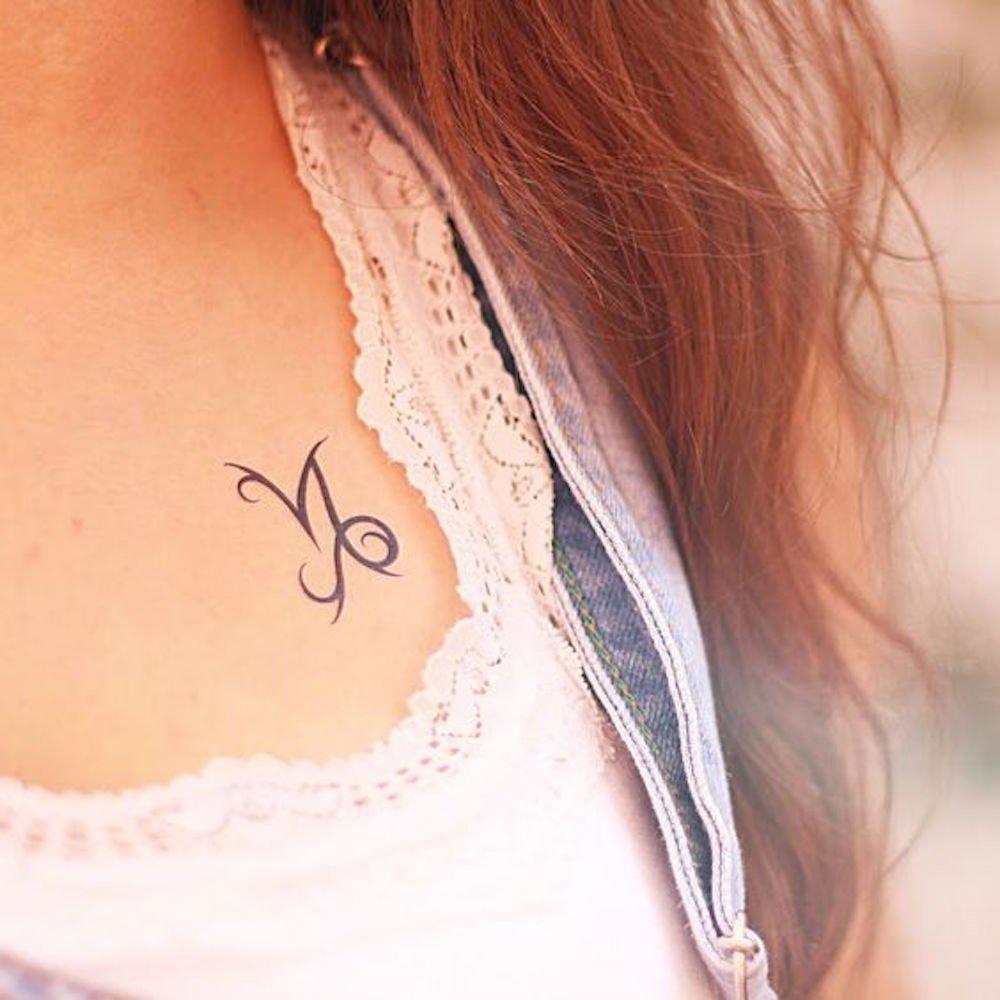 fake small capricorn zodiac sign horoscope minimalist temporary tattoo sticker design idea on chest