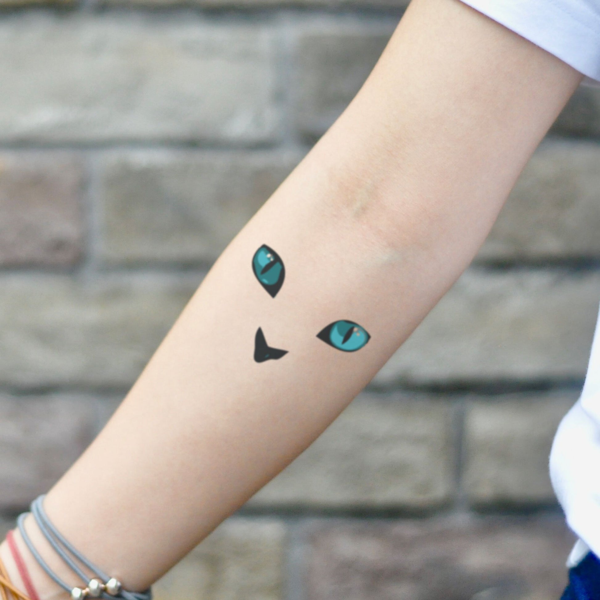 fake small cat eye animal temporary tattoo sticker design idea on inner arm