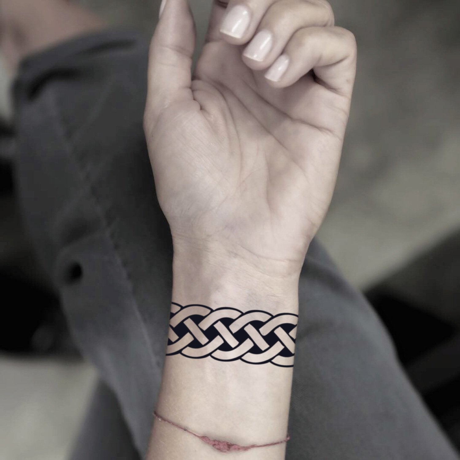 fake small celtic tribal band shackle geometric temporary tattoo sticker design idea on wrist