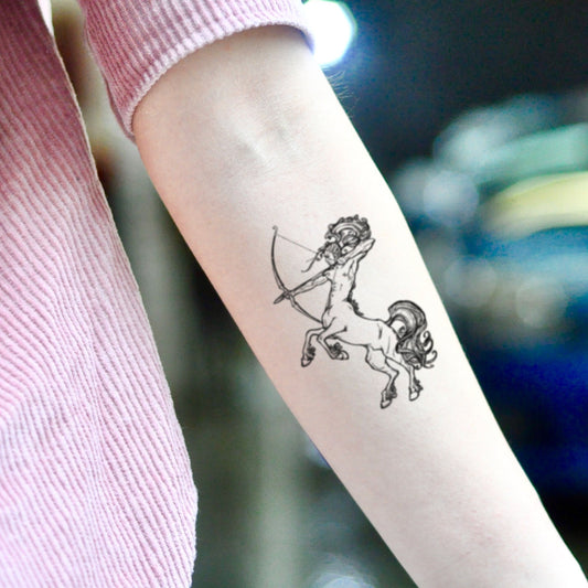 fake small centaur sagittarius zodiac sign illustrative temporary tattoo sticker design idea on inner arm