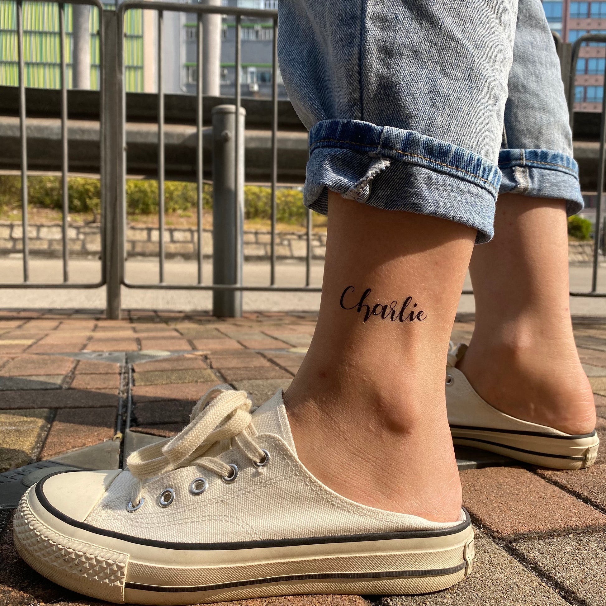 fake small Charlie name lettering temporary tattoo sticker design idea on ankle leg
