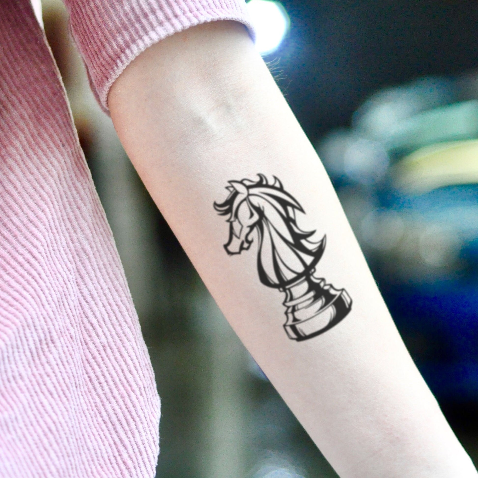 fake small chess knight piece illustrative temporary tattoo sticker design idea on inner arm