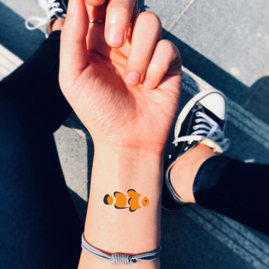 fake small clownfish finding nemo animal temporary tattoo sticker design idea on wrist