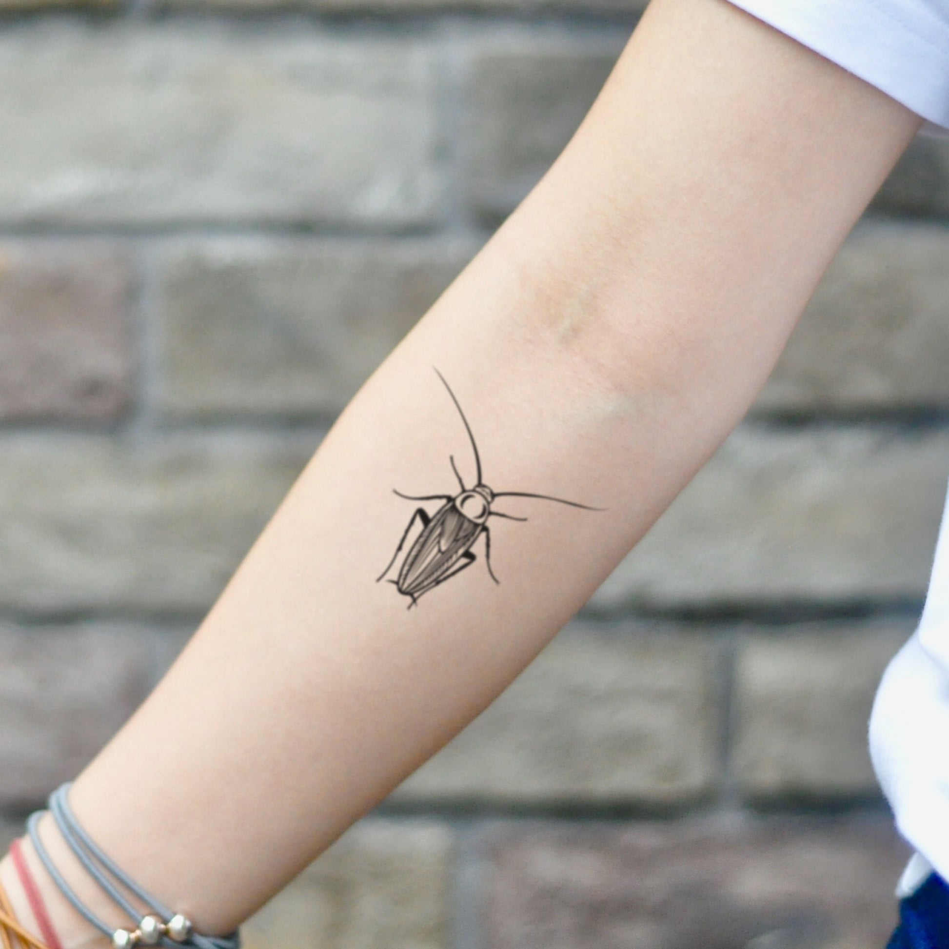 fake small cockroach roach animal temporary tattoo sticker design idea on inner arm