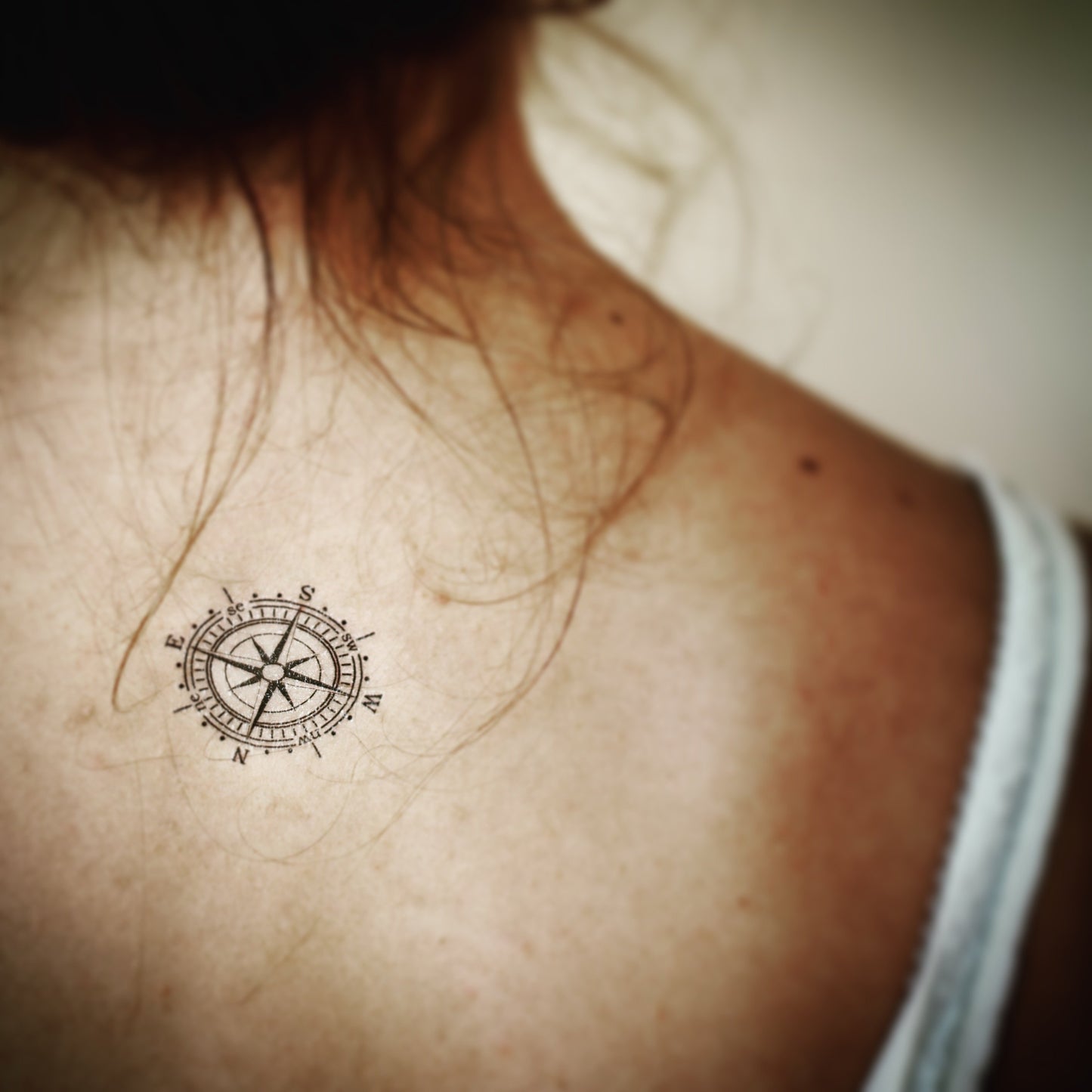 fake small moral compass nautical map navigation wanderer illustrative temporary tattoo sticker design idea on back