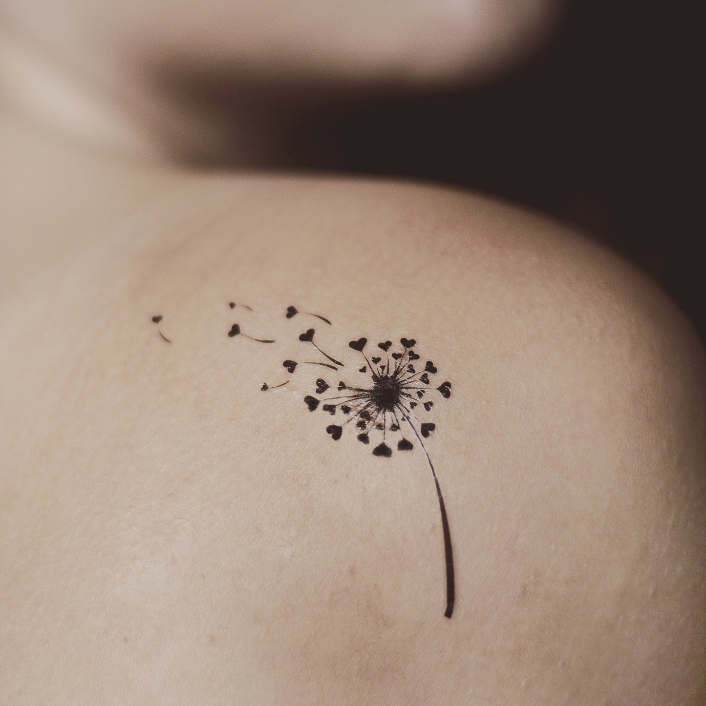 fake small dandelion flower temporary tattoo sticker design idea on shoulder