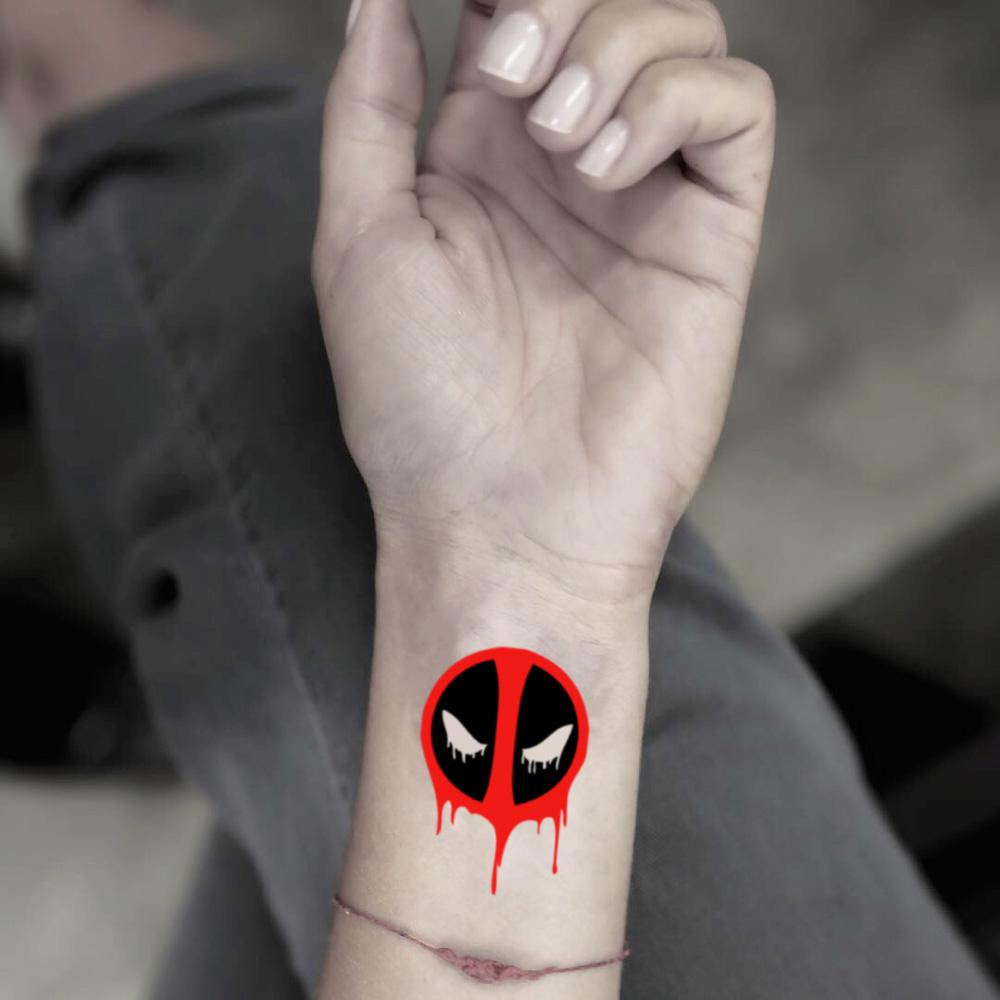 fake small deadpool color temporary tattoo sticker design idea on wrist