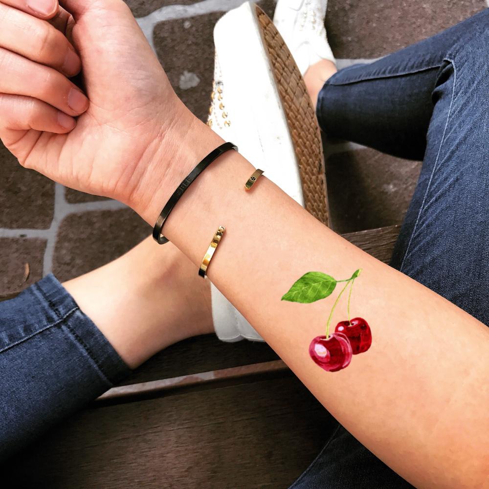 fake small double cherry food color temporary tattoo sticker design idea on forearm