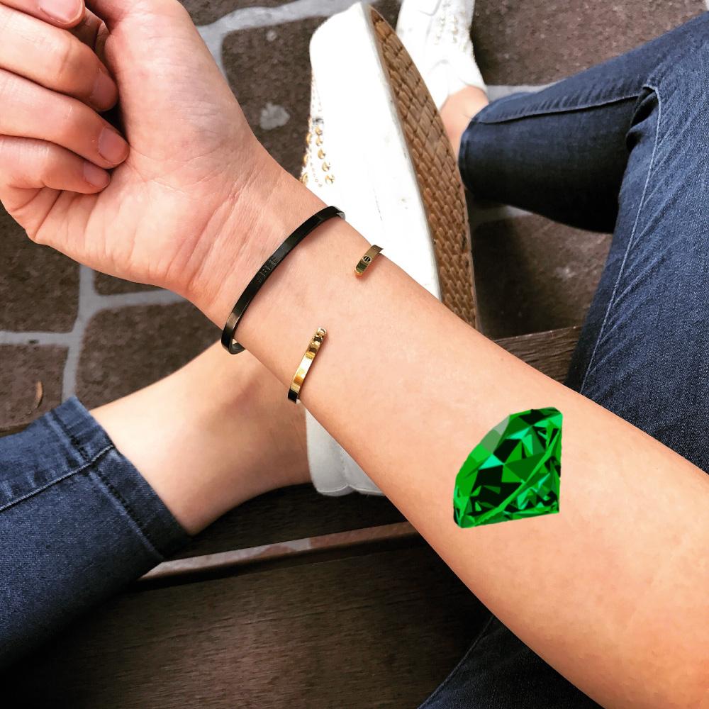 fake small emerald color jewel temporary tattoo sticker design idea on forearm