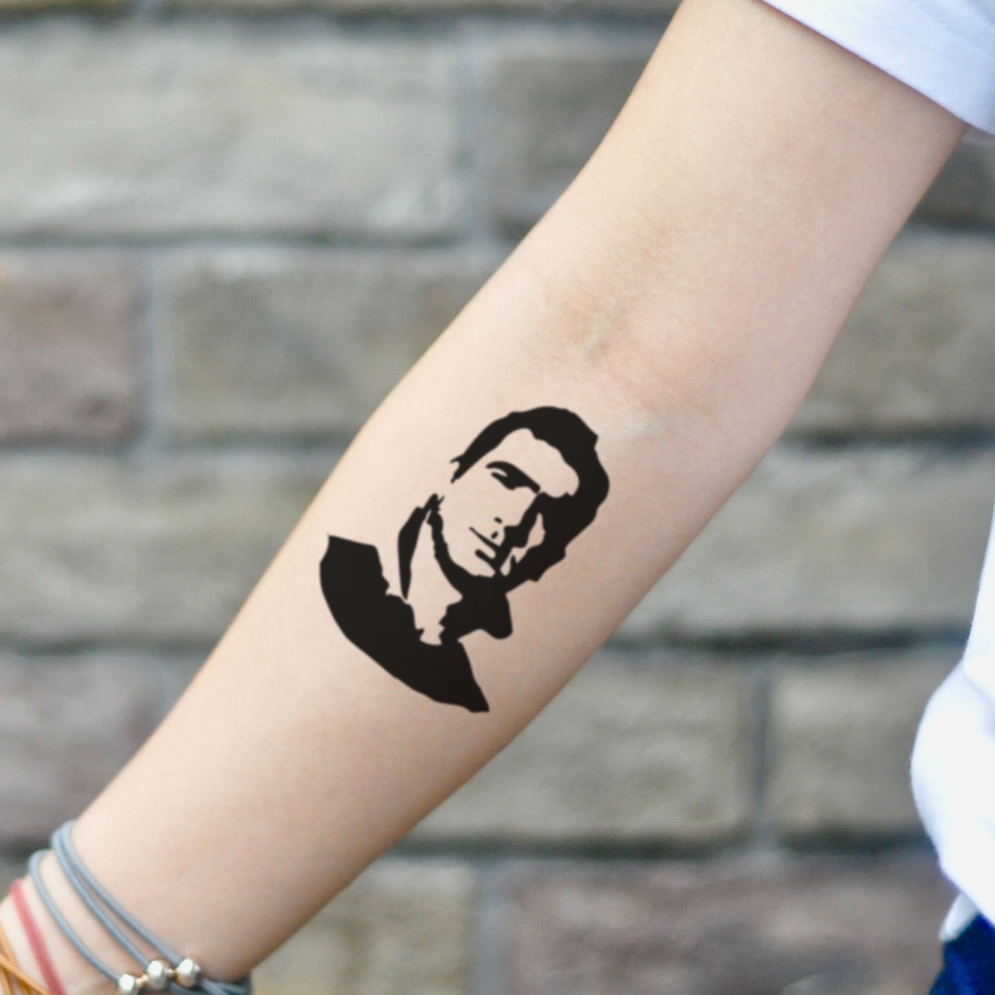 fake small eric cantona portrait temporary tattoo sticker design idea on inner arm