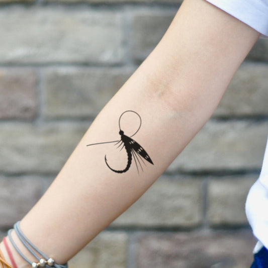 fake small fly fishing hook lure illustrative temporary tattoo sticker design idea on inner arm