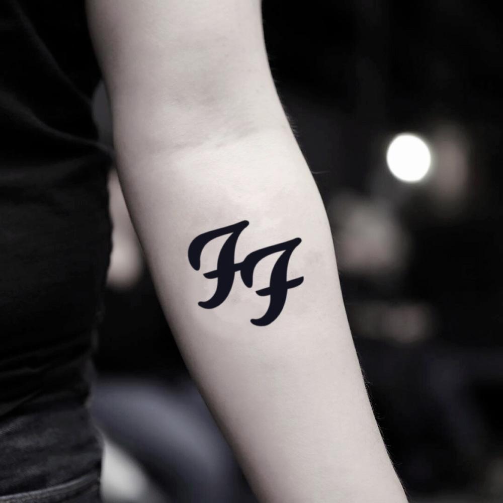 fake small foo fighters lettering temporary tattoo sticker design idea on inner arm