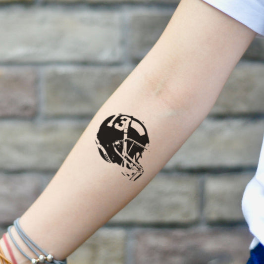 fake small football helmet illustrative temporary tattoo sticker design idea on inner arm