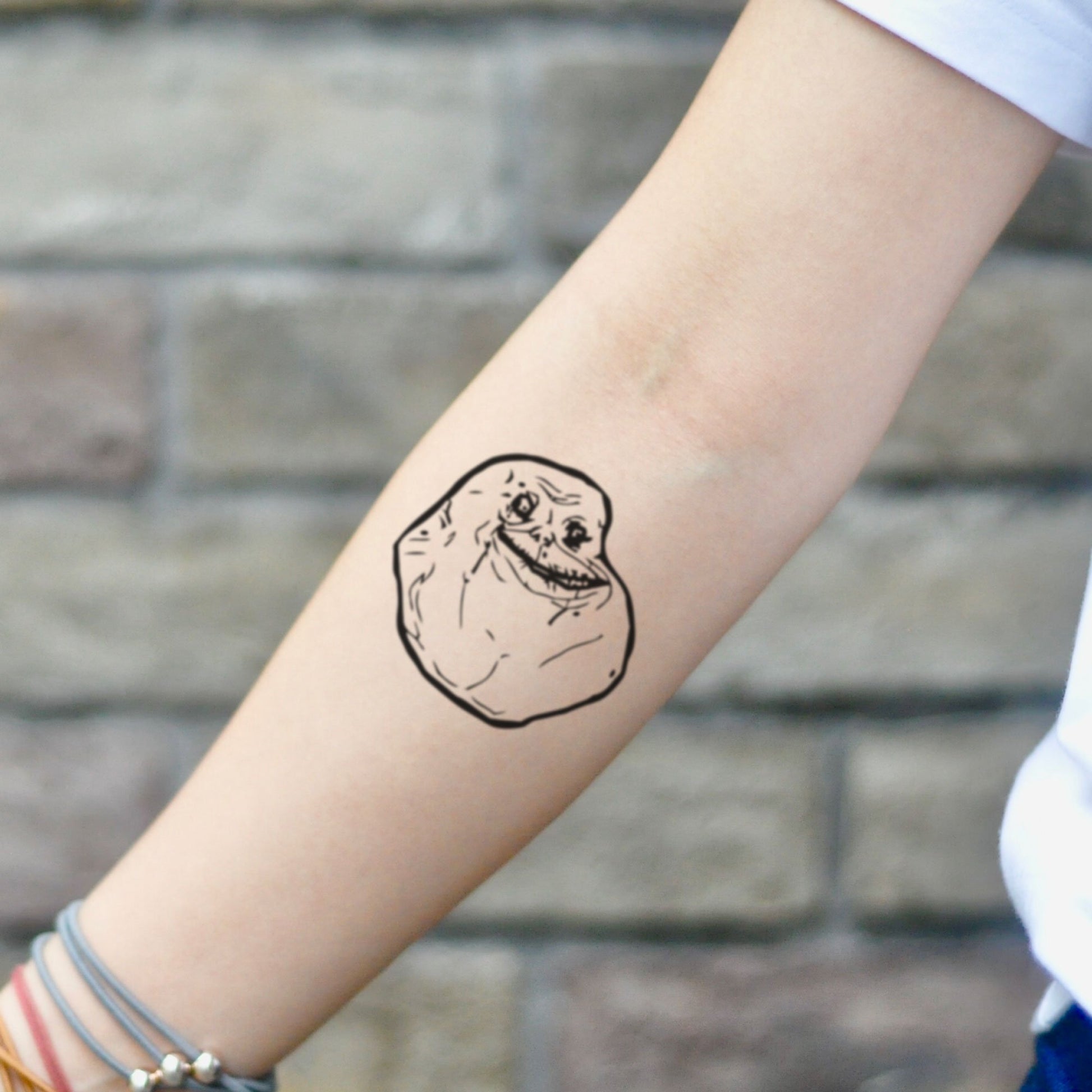 fake small forever alone meme illustrative temporary tattoo sticker design idea on inner arm