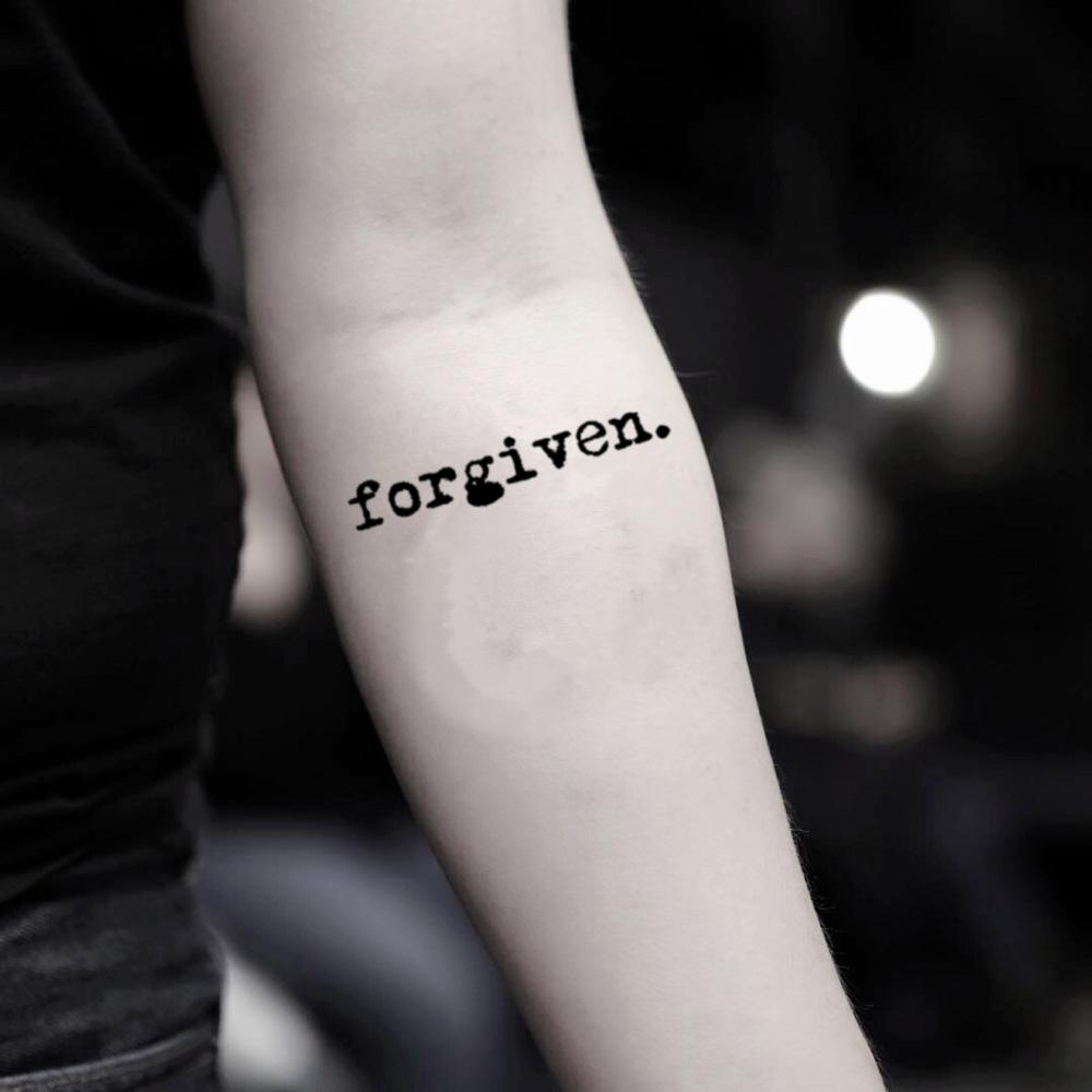 fake small forgiven word lettering temporary tattoo sticker design idea on inner arm