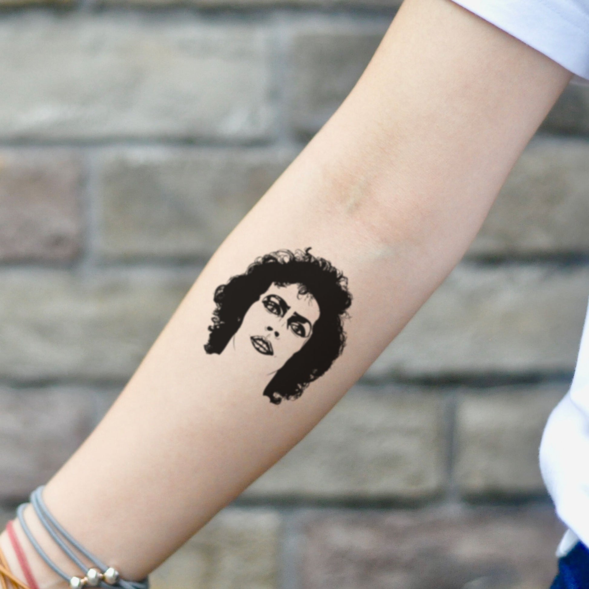 fake small frank n furter portrait temporary tattoo sticker design idea on inner arm