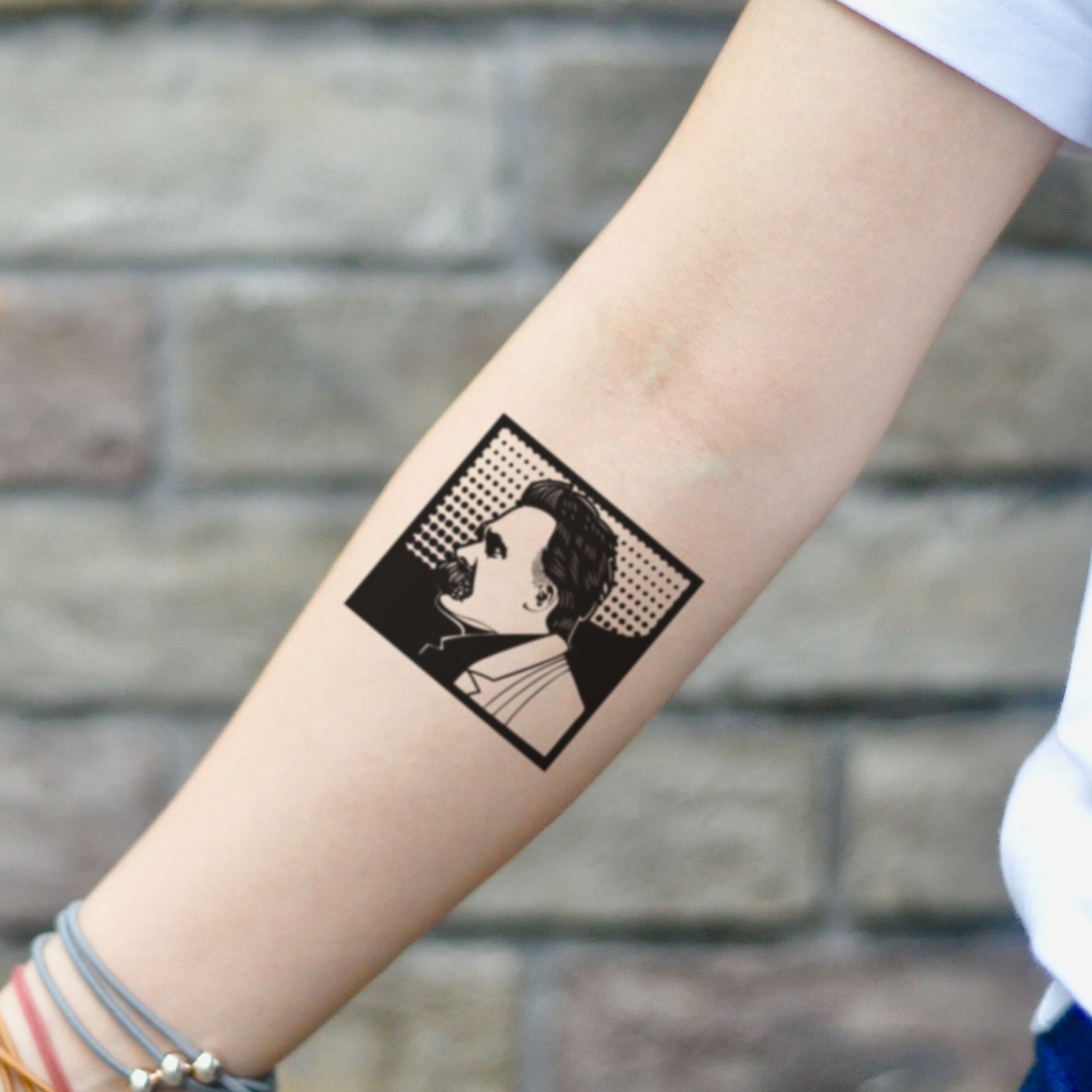 fake small friedrich nietzsche nihilism portrait temporary tattoo sticker design idea on inner arm