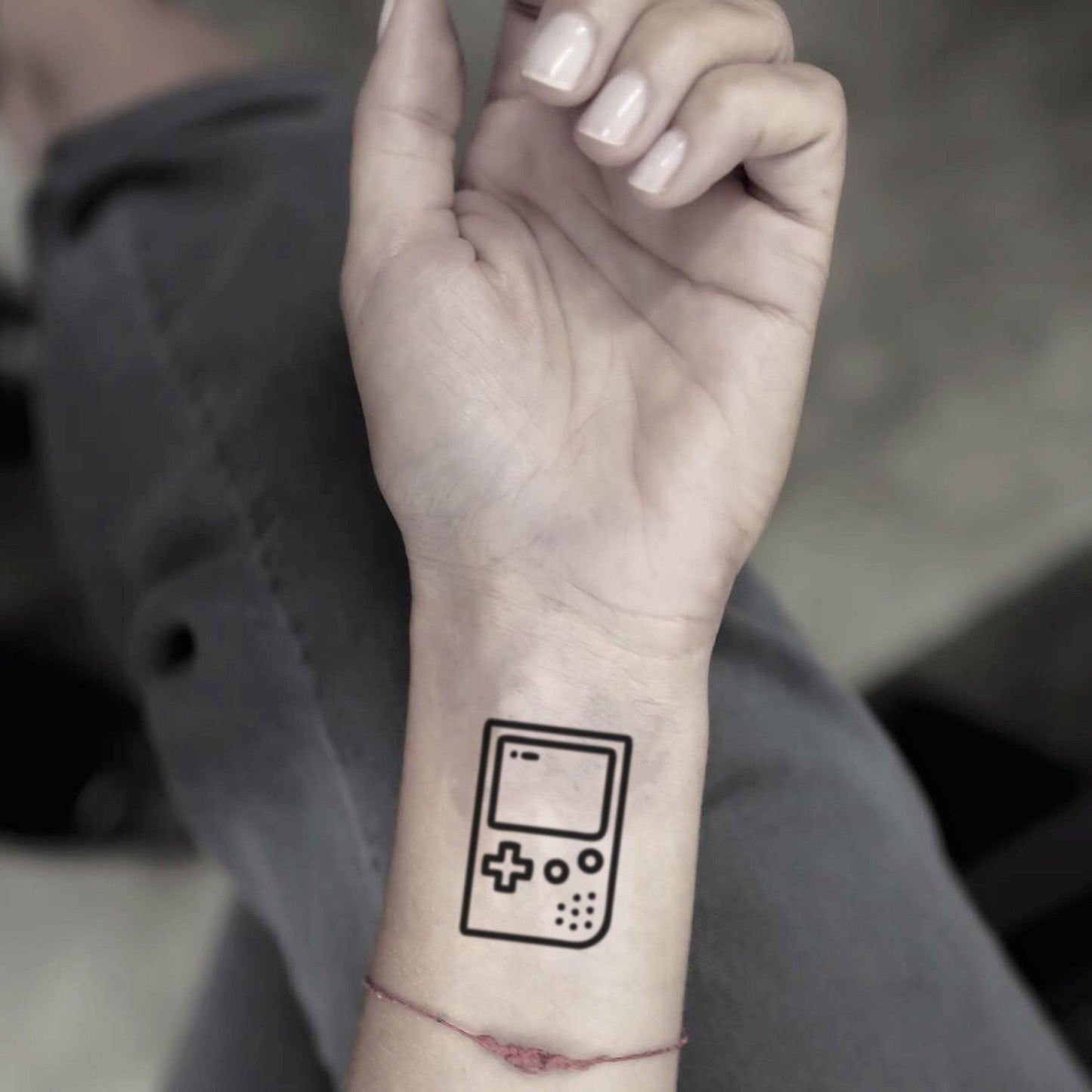 fake small gameboy pocket gamer console minimalist temporary tattoo sticker design idea on wrist