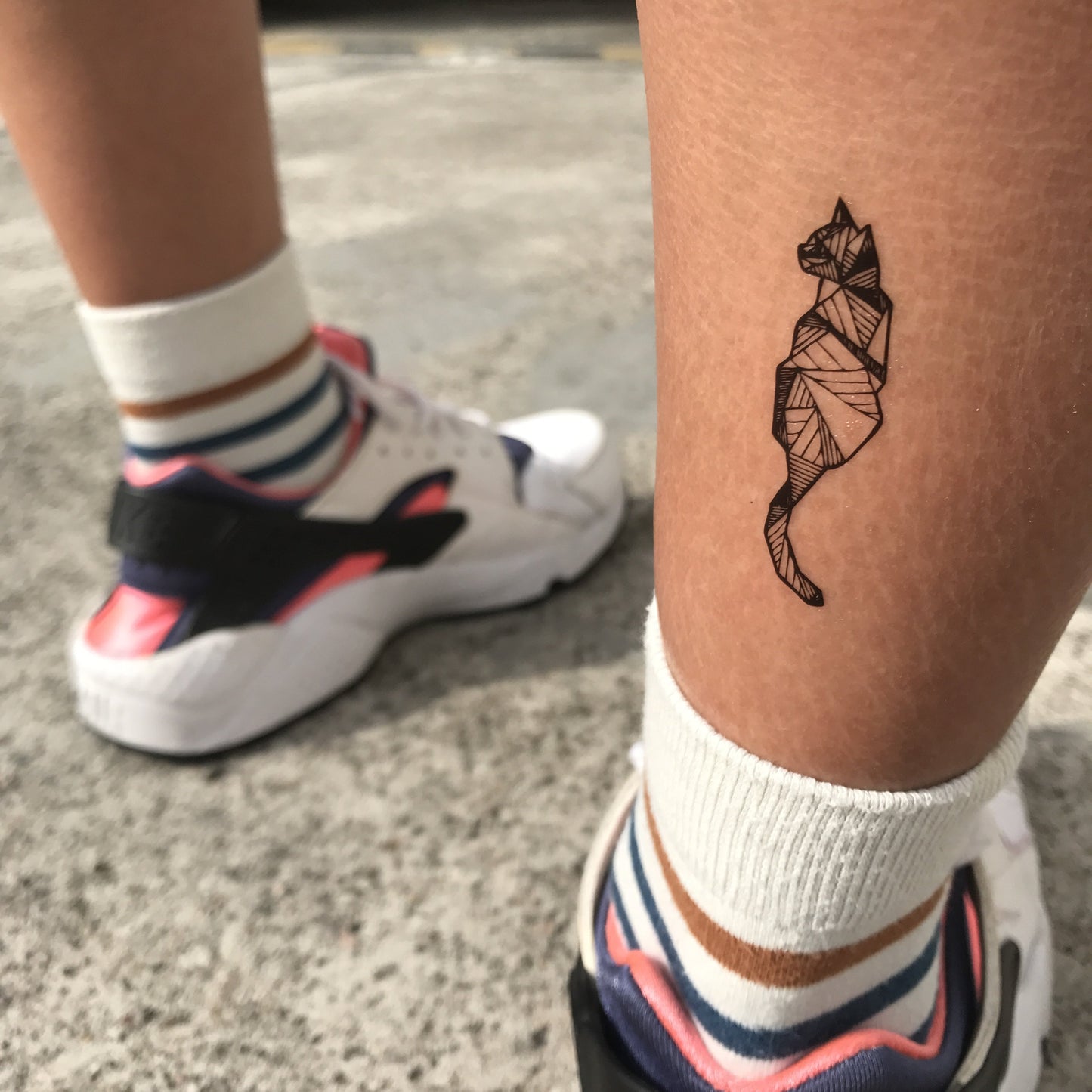 fake small cool geometric cat animal temporary tattoo sticker design idea on ankle dry skin