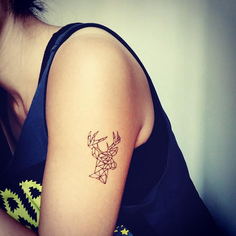 fake small geometric deer animal temporary tattoo sticker design idea on upper arm