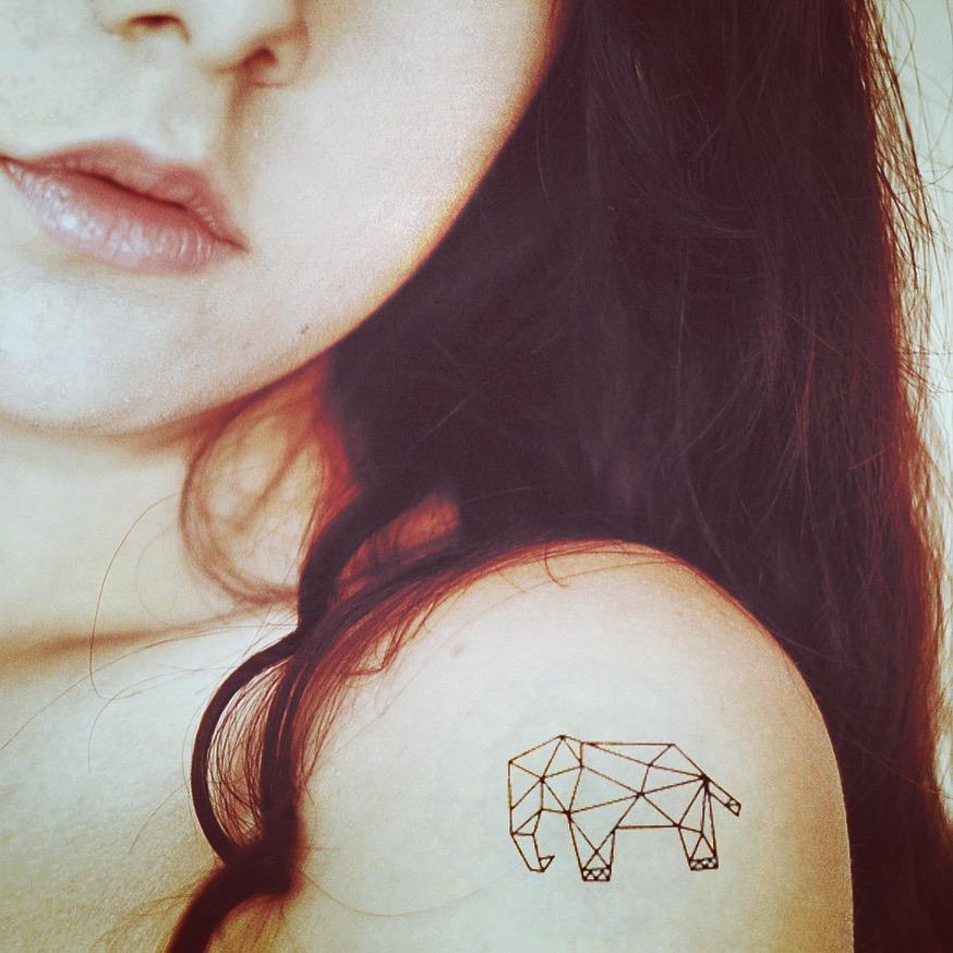 fake small geometric elephant animal temporary tattoo sticker design idea on shoulder