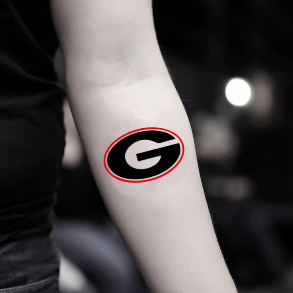 fake small uga georgia bulldog lettering temporary tattoo sticker design idea on inner arm