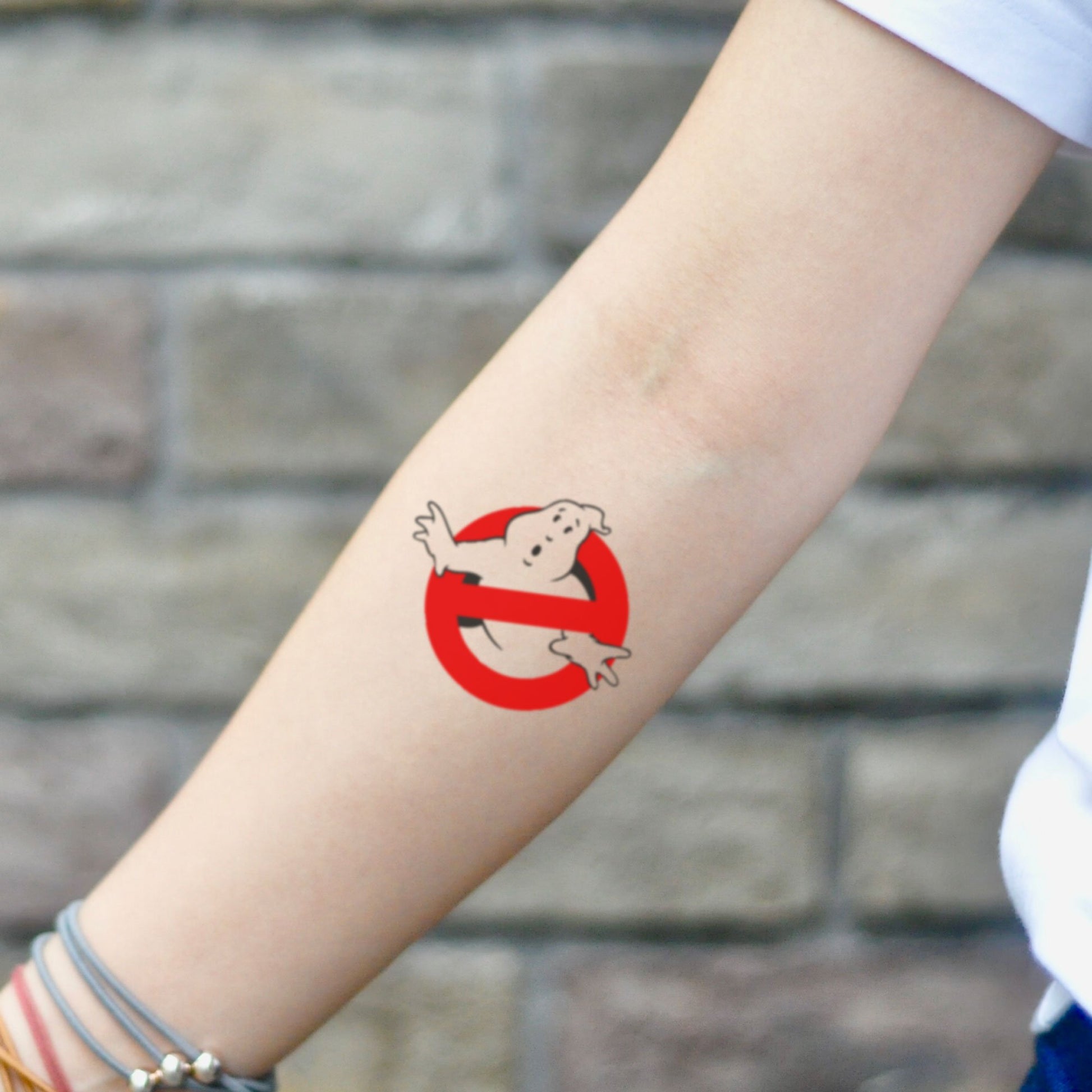 fake small ghostbusters color temporary tattoo sticker design idea on inner arm