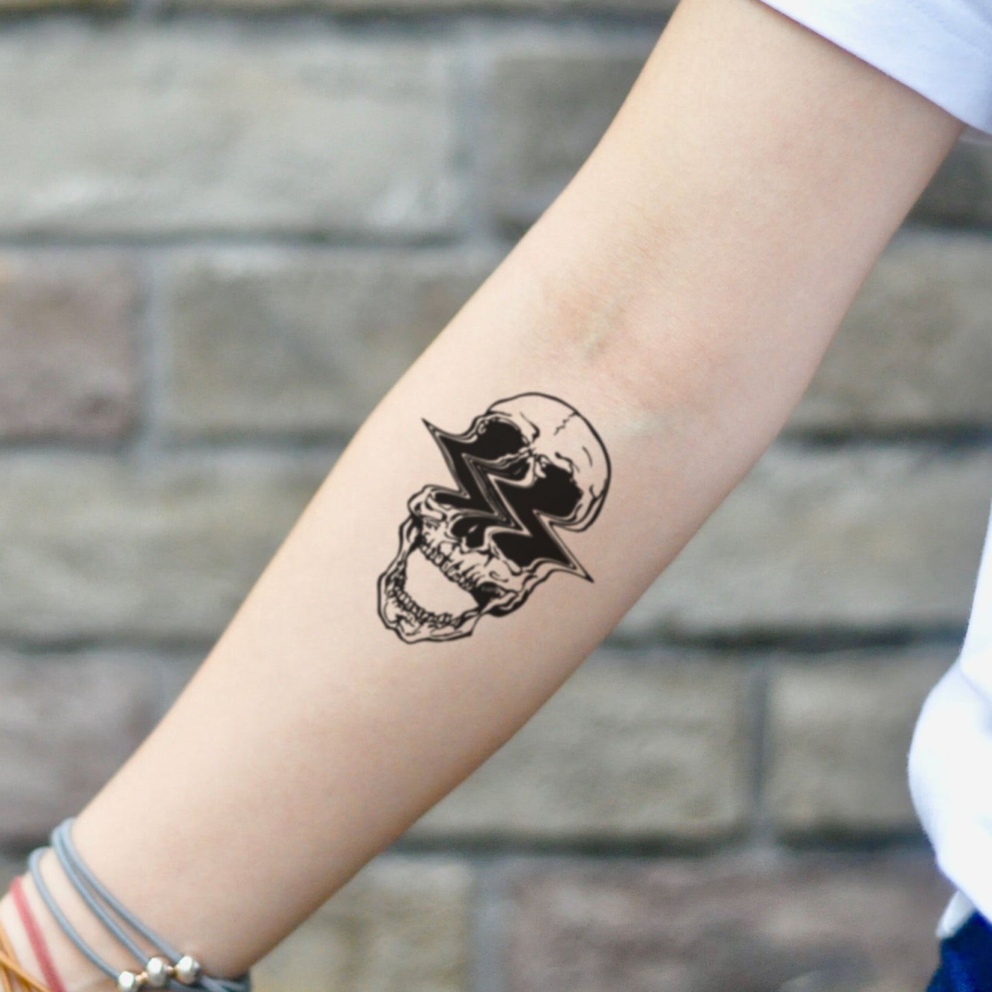 fake small glitch skull abstract trippy aesthetic illustrative temporary tattoo sticker design idea on inner arm
