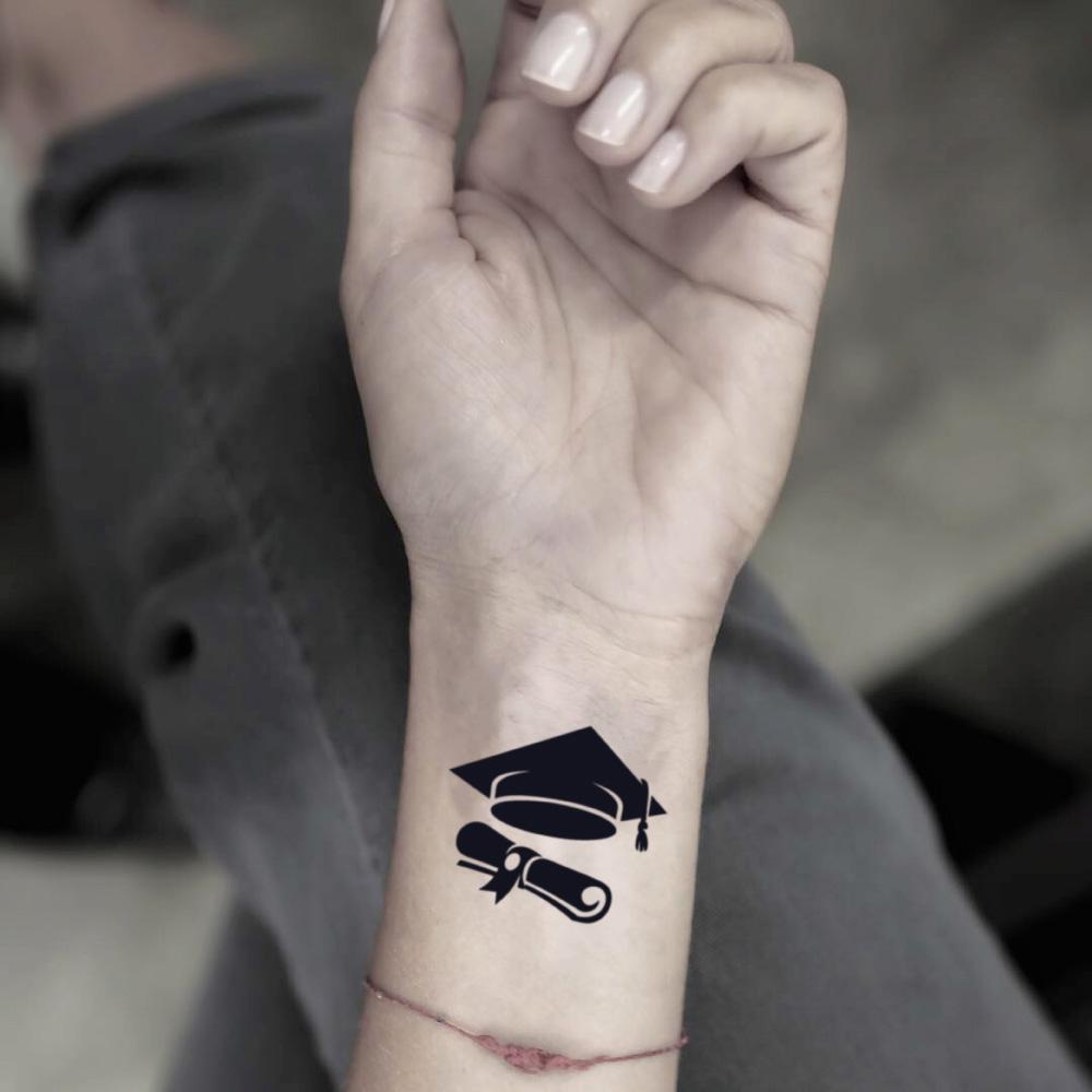 fake small graduation illustrative temporary tattoo sticker design idea on wrist