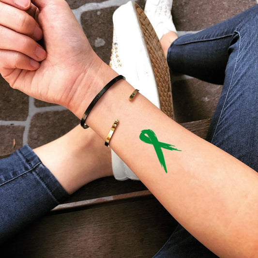 fake small green ribbon lymphoma color temporary tattoo sticker design idea on forearm