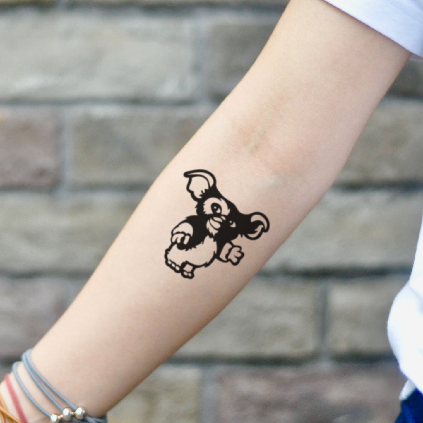 fake small gremlins gizmo skinny cartoon temporary tattoo sticker design idea on inner arm