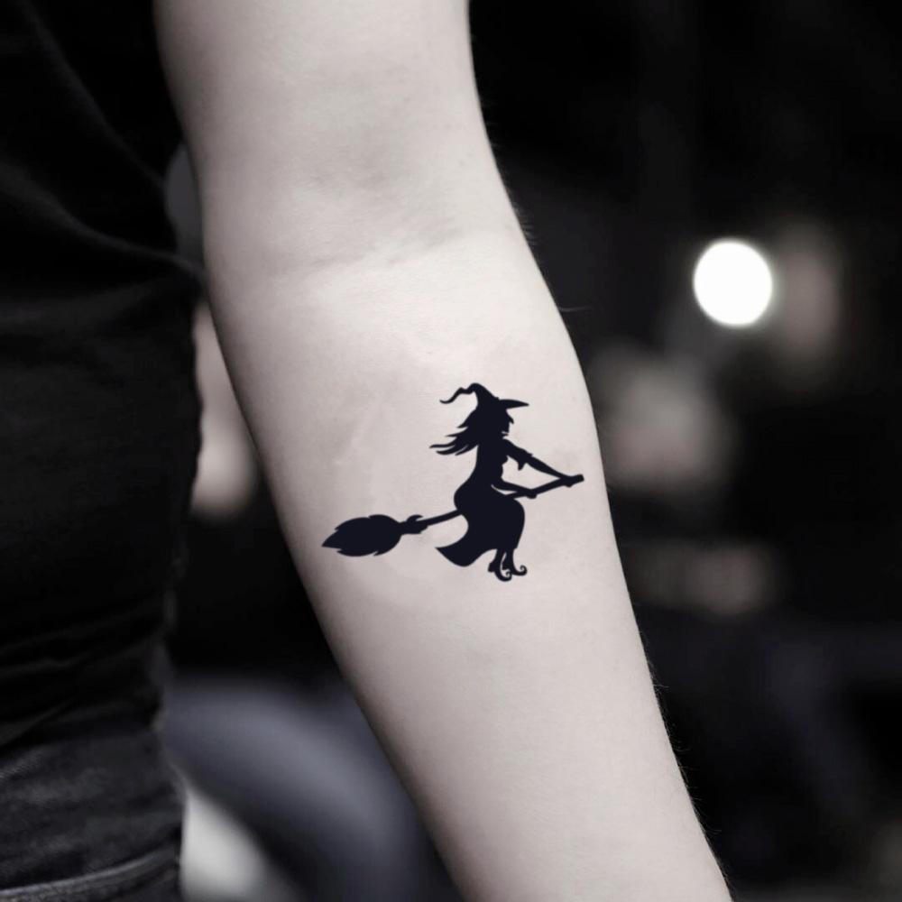 fake small halloween witch minimalist temporary tattoo sticker design idea on inner arm
