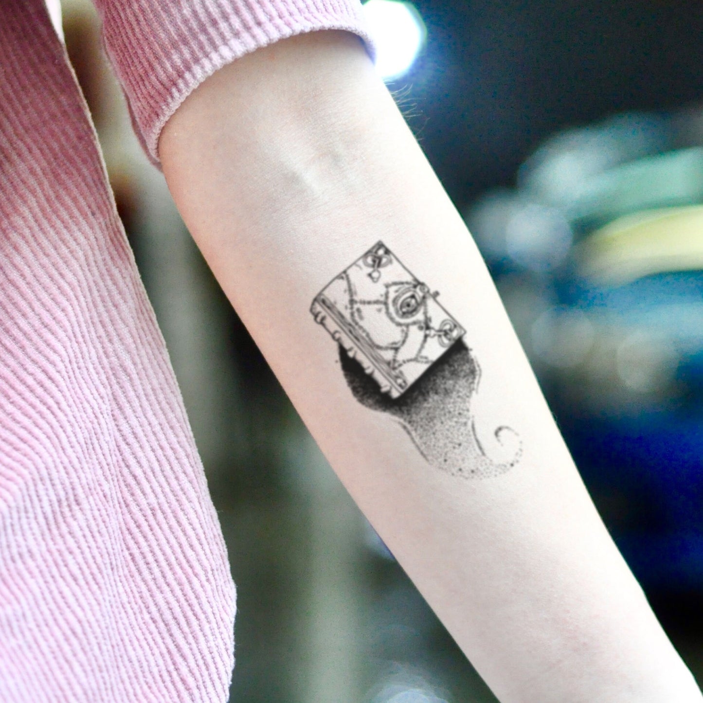 fake small hocus pocus spellbook illustrative temporary tattoo sticker design idea on inner arm