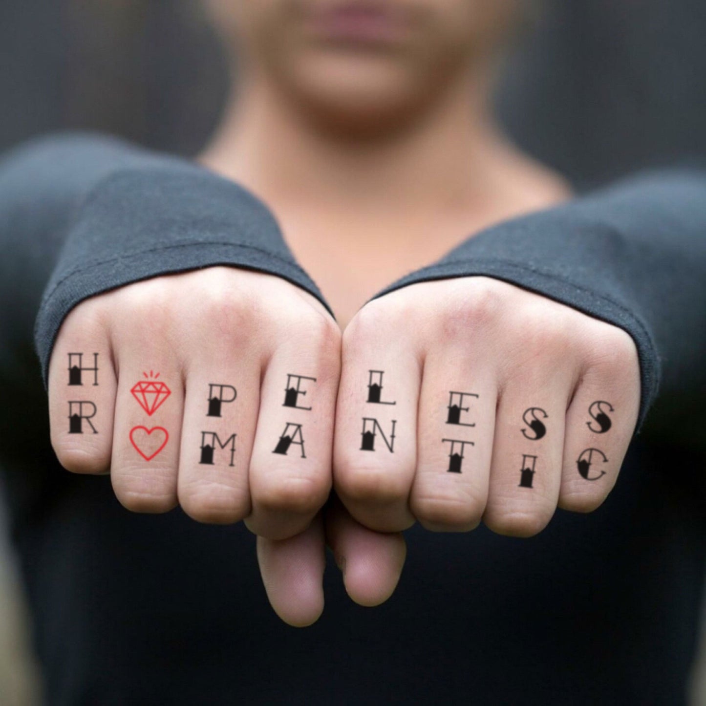 fake small hopeless romantic lettering temporary tattoo sticker design idea on finger