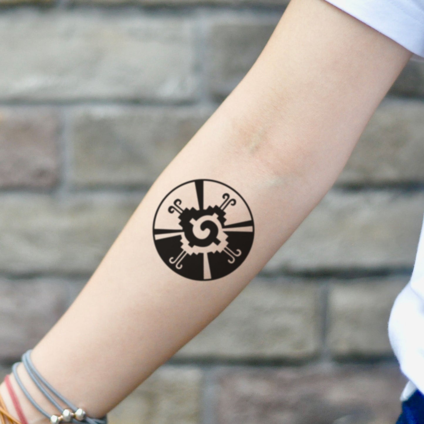 fake small hunab ku symbol mayan geometric temporary tattoo sticker design idea on inner arm