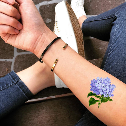 fake small hydrangea blue flower color temporary tattoo sticker design idea on forearm