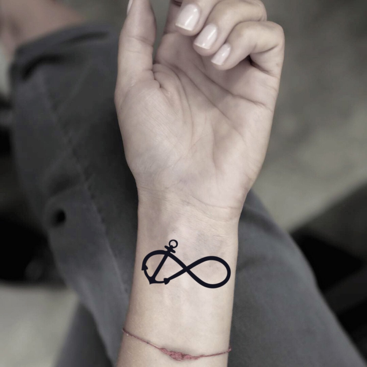 fake small infinity anchor cliche minimalist temporary tattoo sticker design idea on wrist