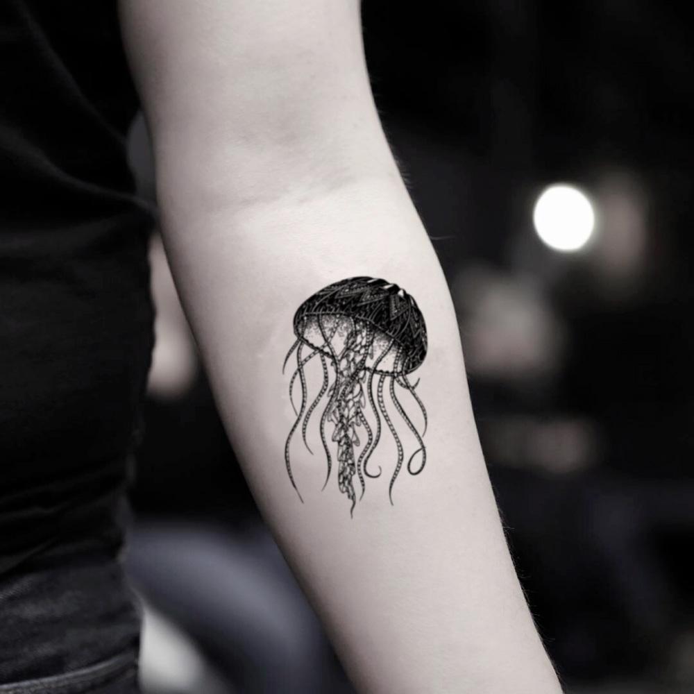 fake small jellyfish animal temporary tattoo sticker design idea on inner arm