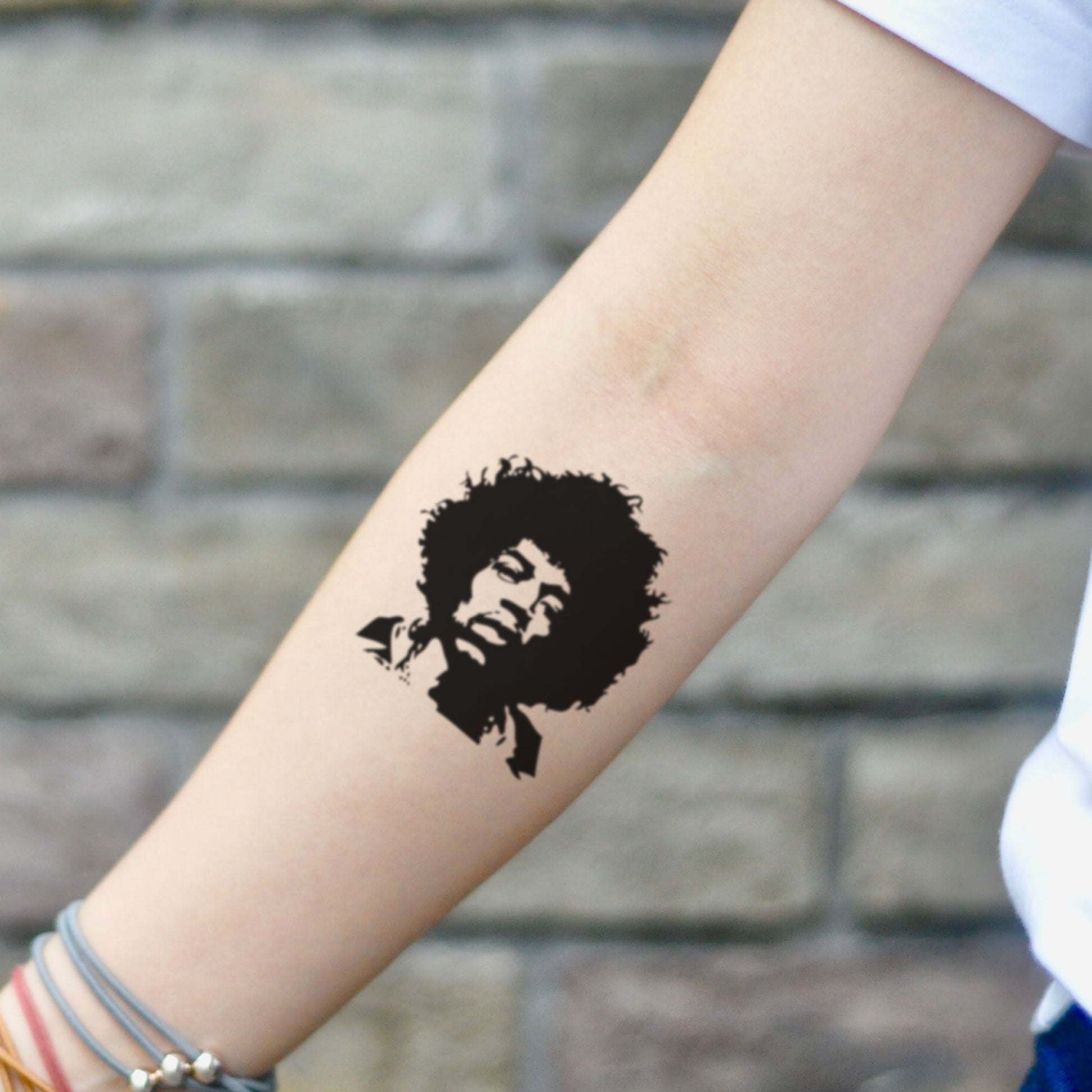 fake small jimi hendrix portrait temporary tattoo sticker design idea on inner arm