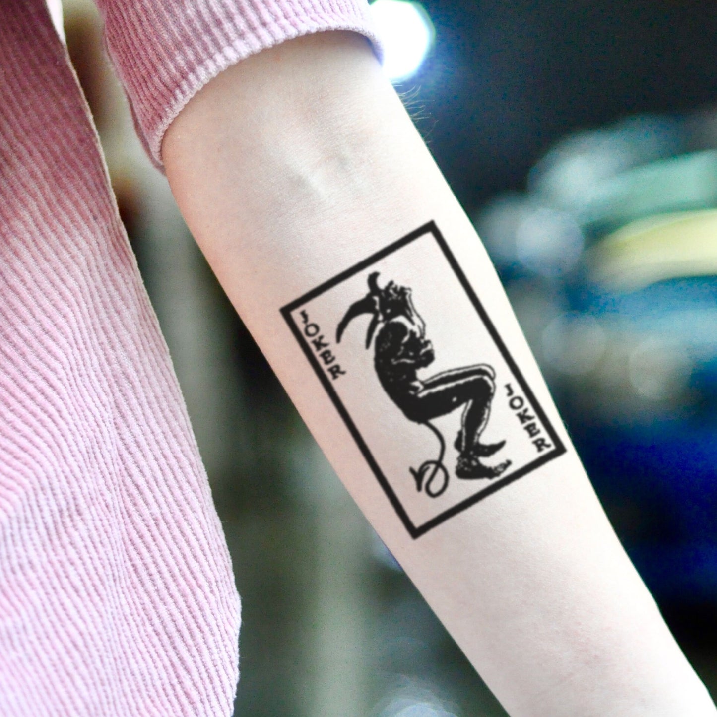 fake small joker playing card illustrative temporary tattoo sticker design idea on inner arm