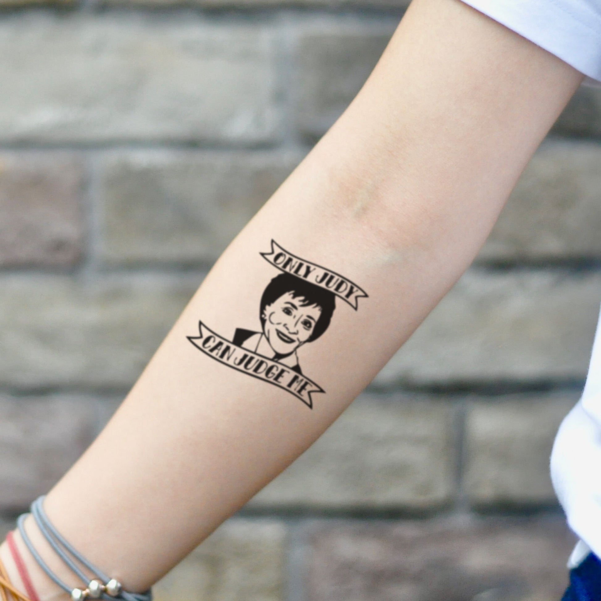 fake small judge judy illustrative temporary tattoo sticker design idea on inner arm