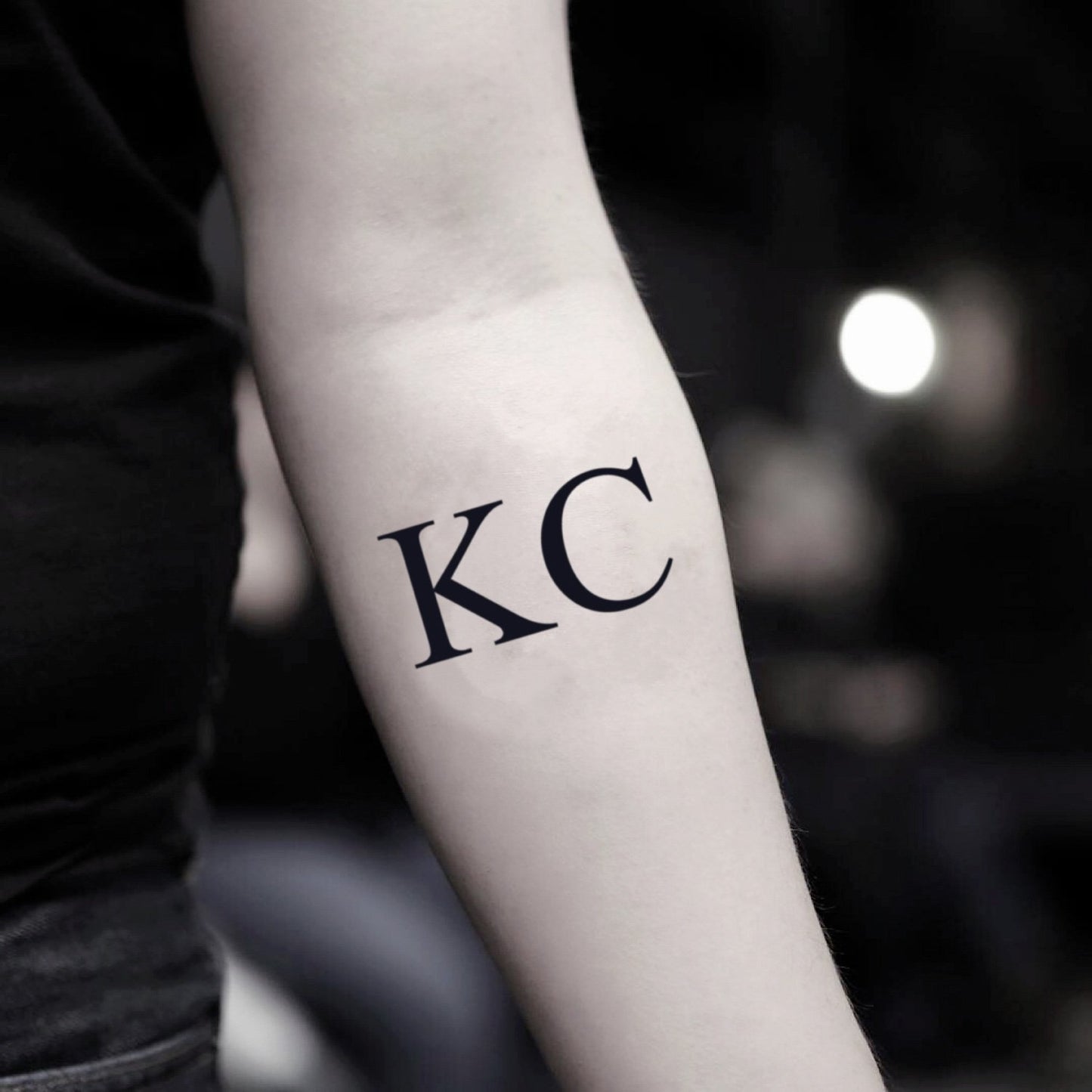 fake small kc lettering temporary tattoo sticker design idea on inner arm