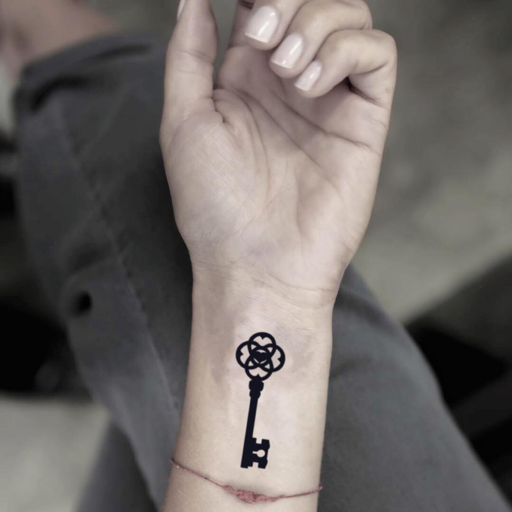 fake small skeleton key keyblade illustrative temporary tattoo sticker design idea on wrist